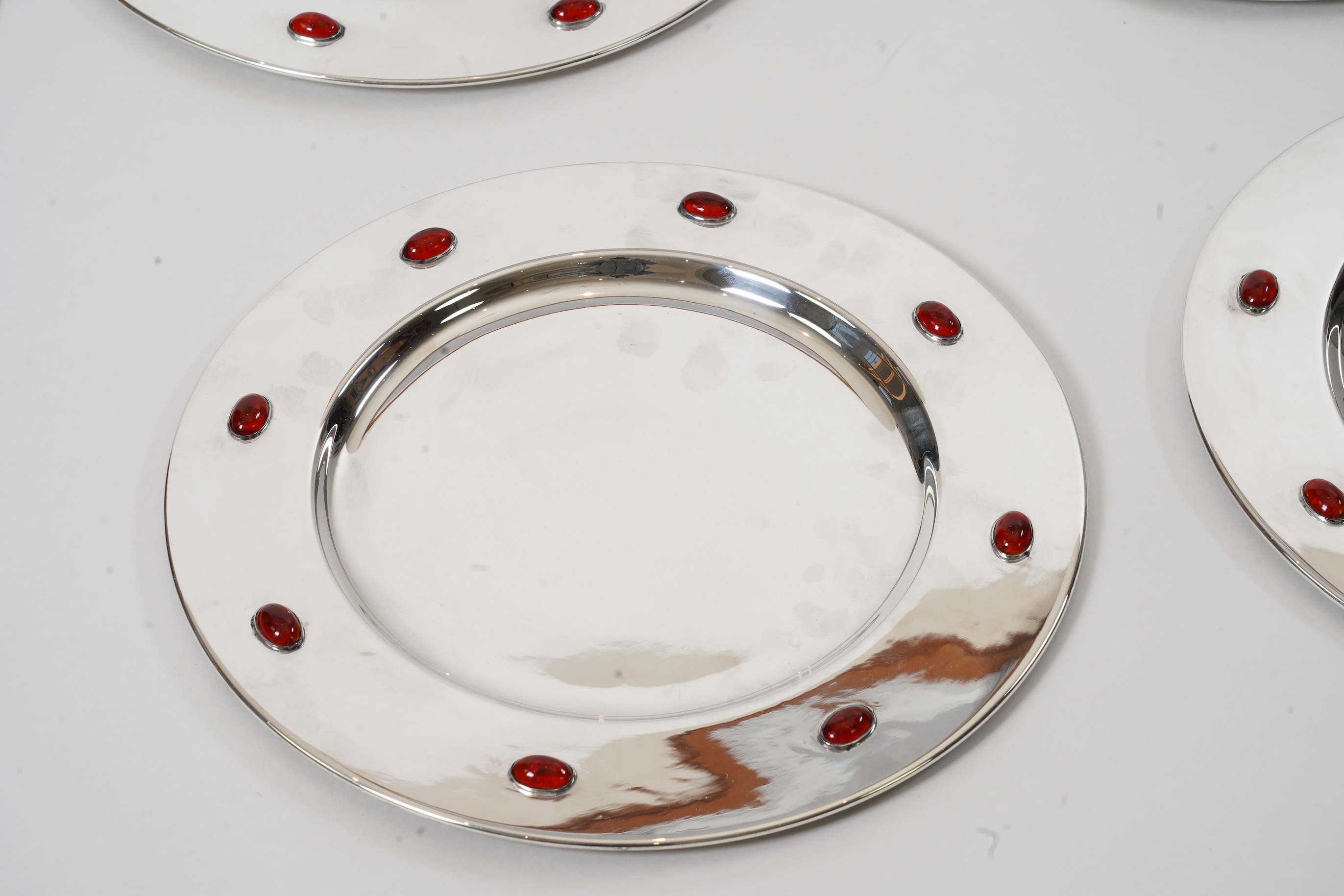 A set of six Glasgow School Arts & Crafts silver plated and cabochon glass set dinner plates
